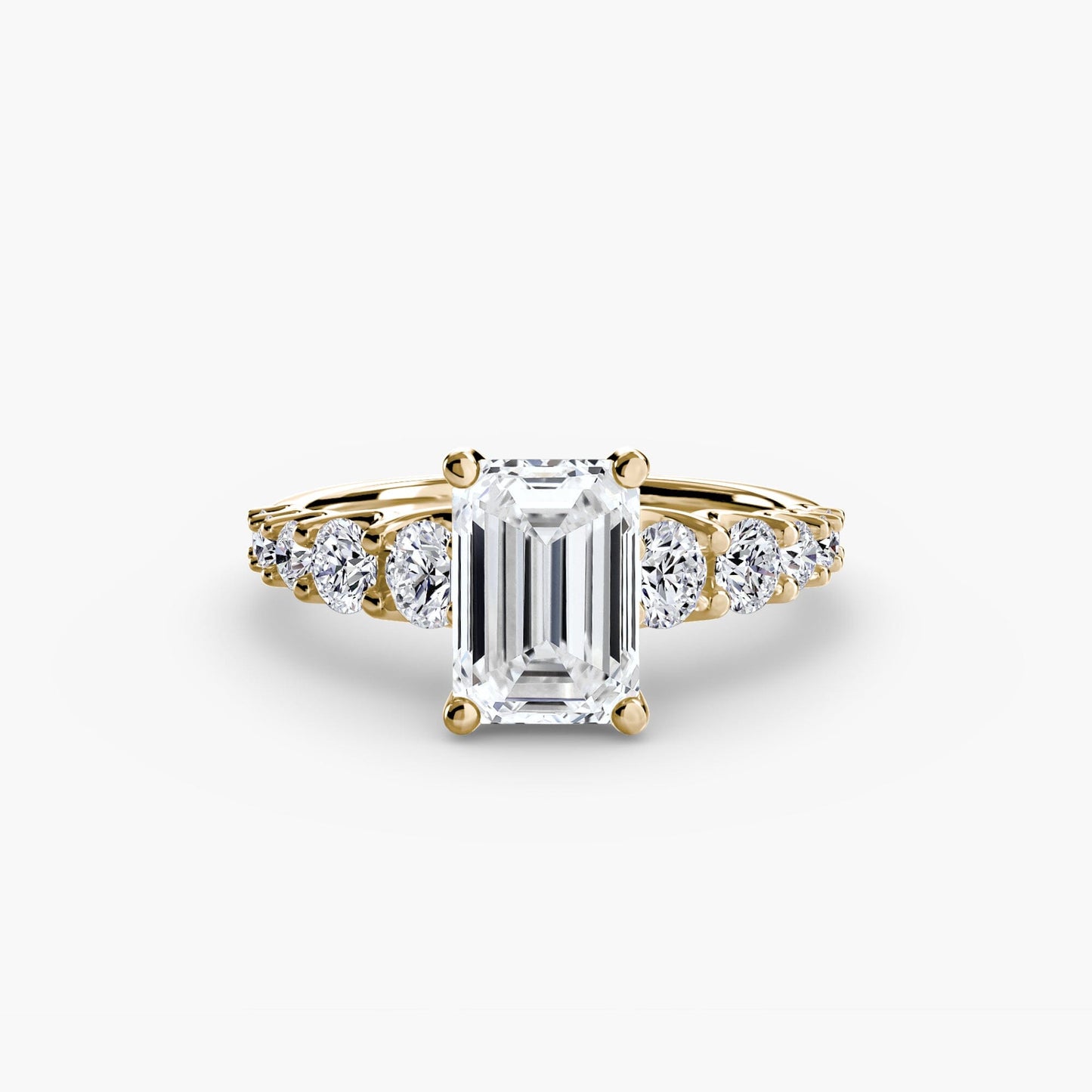 The Graduated Accent Ring setting Aces Jewellers 9K Yellow Gold Emerald 