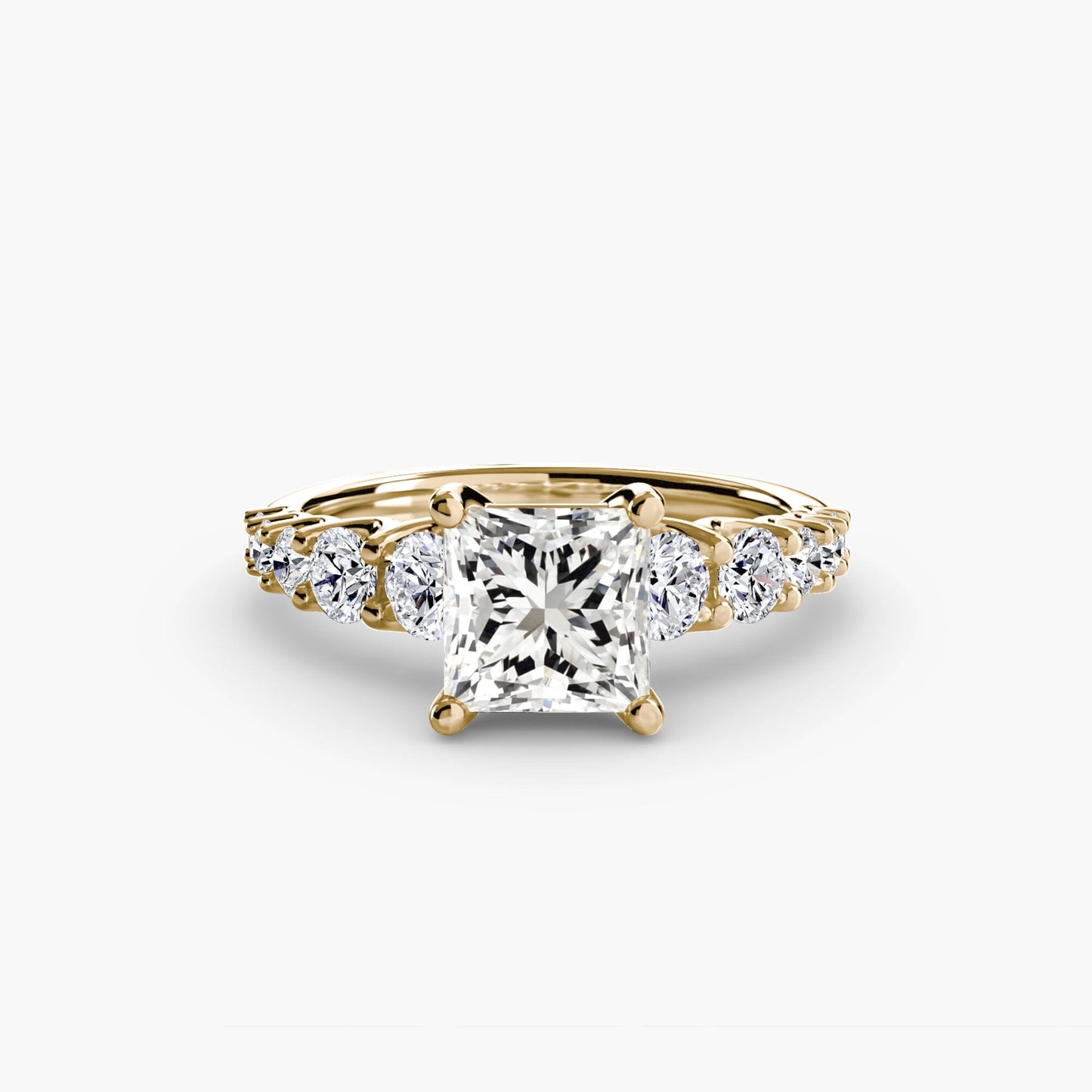 The Graduated Accent Ring setting Aces Jewellers 9K Yellow Gold Princess 