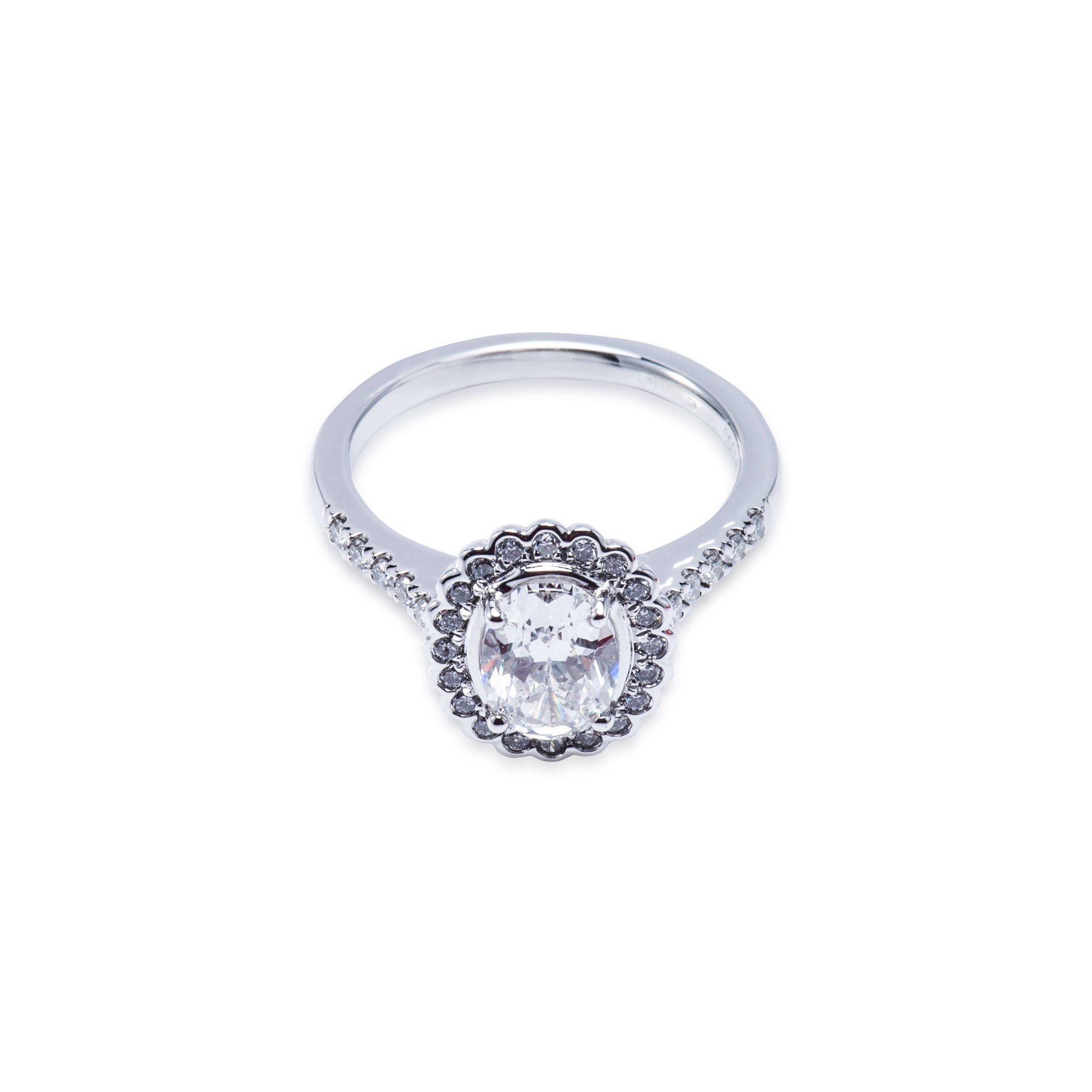 Platinum diamond oval shape halo style engagement ring with diamond shoulders Aces Jewellers 
